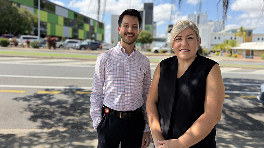 Jacob Goves and Lisa Blackler smiling at camera in front of Rockhampton Hospital