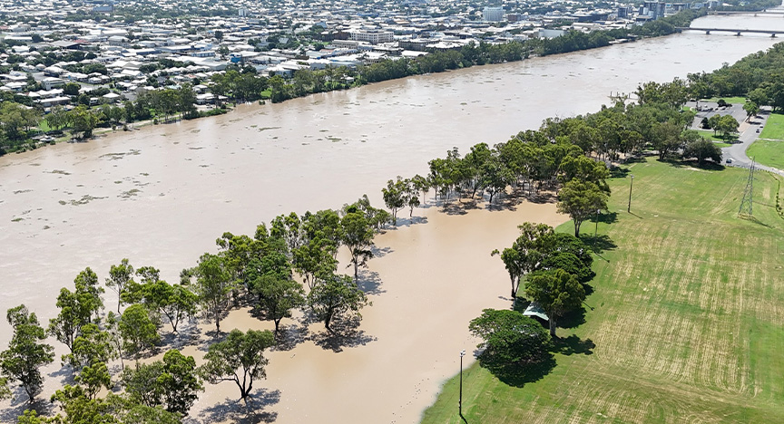 An aerial photo of a river in flood showing water lying around in Rockhampton