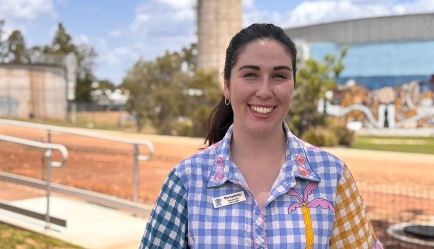 Bernie smiling to the camera as she stands outside on a sunny day at Biloela Hospital.
